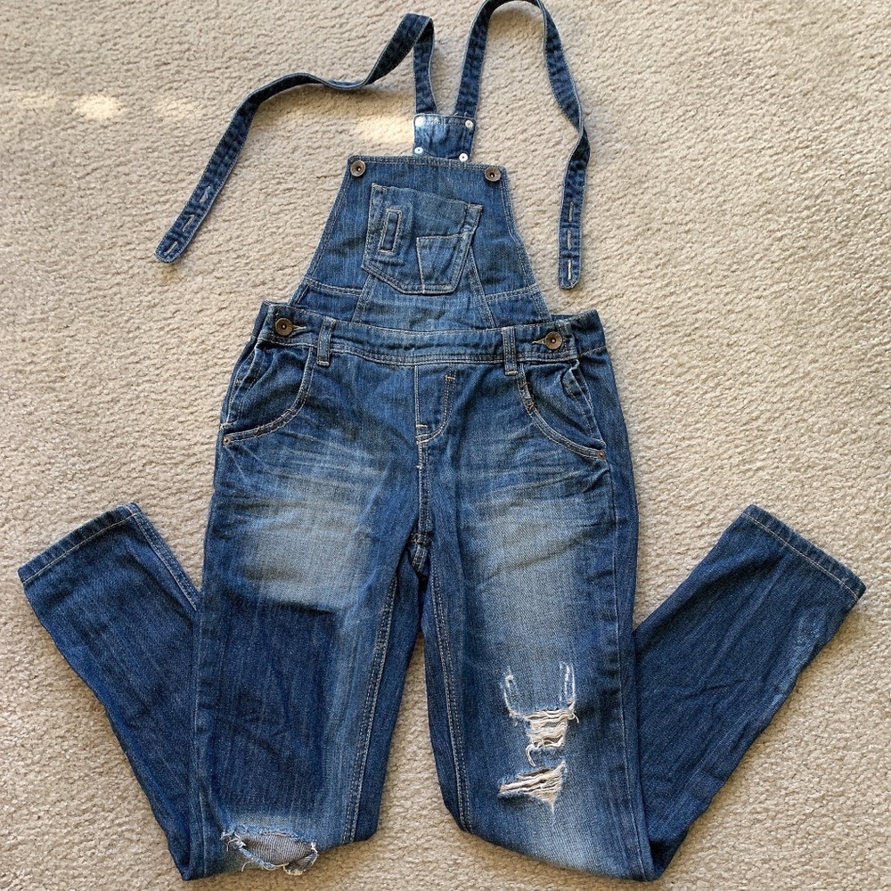 Blue distressed denim overalls